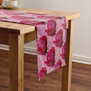 red roses on pink short table runner