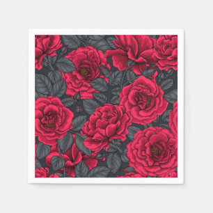 Red roses with grey leaves on black napkin