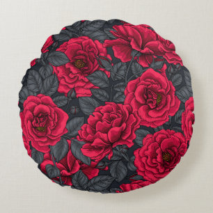 Red roses with grey leaves on black round pillow