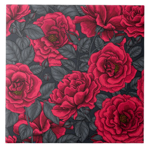 Red roses with grey leaves on black tile