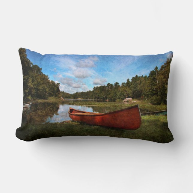 Red rustic canoe on a lake bank lumbar pillow (Front)