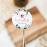 Red Santa Baby Christmas Baby Clothes Baby Shower Classic Round Sticker<br><div class="desc">The Red Santa Baby Christmas Baby Clothes Baby Shower Classic Round Sticker adds a festive touch to your holiday-themed baby shower favours and decorations! Featuring a charming design with adorable red Santa baby clothes on a Christmas clothesline, this sticker captures the joyful spirit of the season. It’s the perfect finishing...</div>