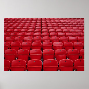 Red seats at football stadium poster