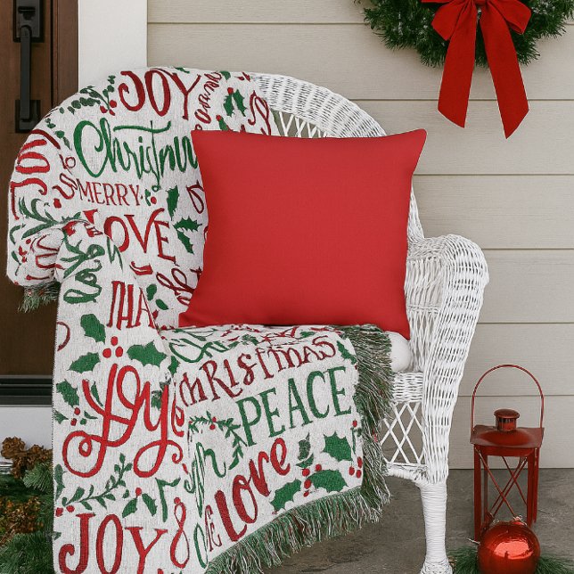  Red Solid Colour Outdoor Pillow (“Add festive red to your porch with this cozy pillow perfect with holiday throws to welcome guests.”)