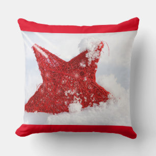 Red star in the snow throw pillow