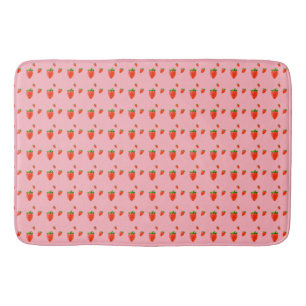 Red Strawberries on pink background Bath Mat