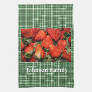 Red strawberry in green plaids kitchen towel. towel