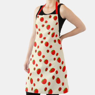 Red strawberry pattern on pale pink apron