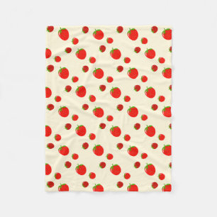 Red strawberry pattern on pale pink fleece blanket