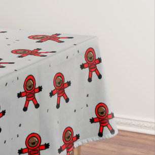 Red suit astronauts on grey  tablecloth