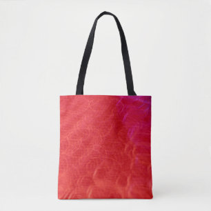 Red swirl pattern on a tote bag