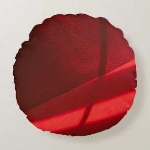 Red textile in close up photography round pillow
