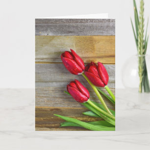 red tulips on wood card