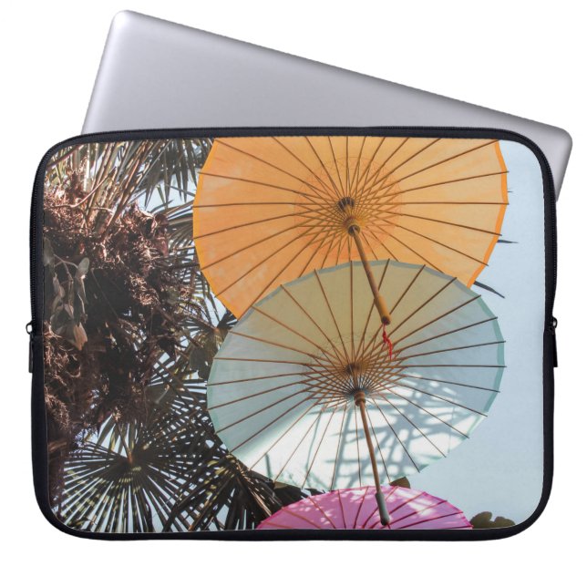 Red umbrella on green tree laptop sleeve (Front)