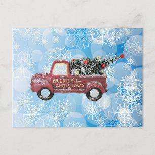 red vintage truck on a blue snowflake background   holiday postcard
