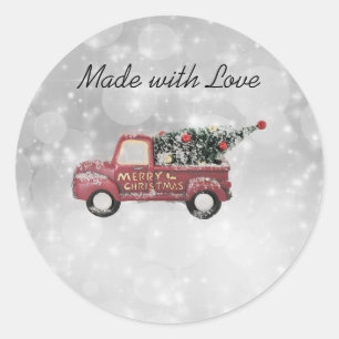 red vintage truck on a grey bokeh background classic round sticker