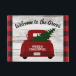 Red Vintage Truck with Christmas Tree Welcome Mat<br><div class="desc">Welcome your guests to your home this year with this festive personalized welcome mat featuring a vintage red pick up truck carrying a Christmas tree fresh from the farm. Easily personalize with your name or family name. Rustic wood, farmhouse style background and trendy red and black buffalo check. Part of...</div>