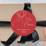 Red white abstract reindeer modern Christmas Classic Round Sticker<br><div class="desc">Red background,  and a white abstract one line reindeer.  Personalize and add a name and year. Text: Merry Christmas</div>