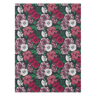 Red, white and bi-colour roses with green leaves o tablecloth