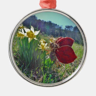 red wing fairy and daffodils metal ornament