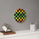 Red Yellow Green Rasta Ombre Chequerboard Round Clock<br><div class="desc">Make a bold statement with the Red Yellow Green Rasta Ombre Chequerboard Round Clock. Featuring a vibrant ombre gradient in classic Rasta colours with a chequered pattern, this clock adds a cultural and energetic touch to any space. Perfect for bringing style and personality to your home or office.</div>