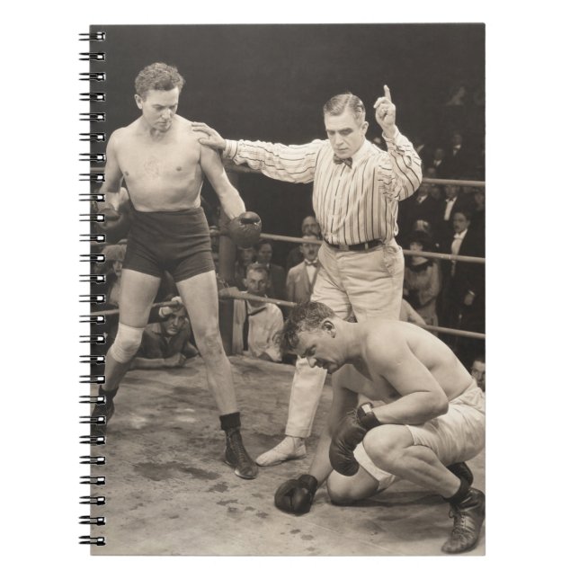Referee counting over boxer in ringboxing, vintage notebook (Front)