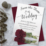 Reflecting Burgundy Rose Elegant Romantic Wedding Save The Date<br><div class="desc">This wedding Save the Date card is romantic, elegant, classy, and beautiful. It features a photograph of a single long-stemmed burgundy colored rose reflecting in a pool of water with waves and ripples. The text is a fancy script calligraphy on a white background. The back features a marbled burgundy, maroon,...</div>