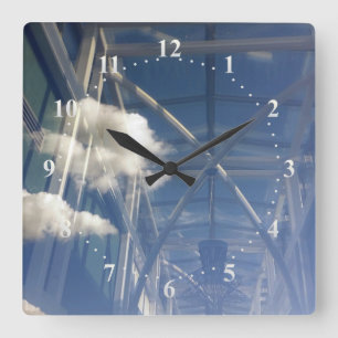 reflections in window square wall clock