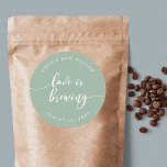 Relax Script Love is Brewing Custom Colour Wedding Classic Round Sticker<br><div class="desc">Wedding sticker featuring the words "Love is Brewing" in a relax cursive script in white against an editable background colour (click customize to access). Personalize it by replacing the placeholder text. For more options such as to change the font and it's size/colour, expand /contract curve or the spacing between letters...</div>