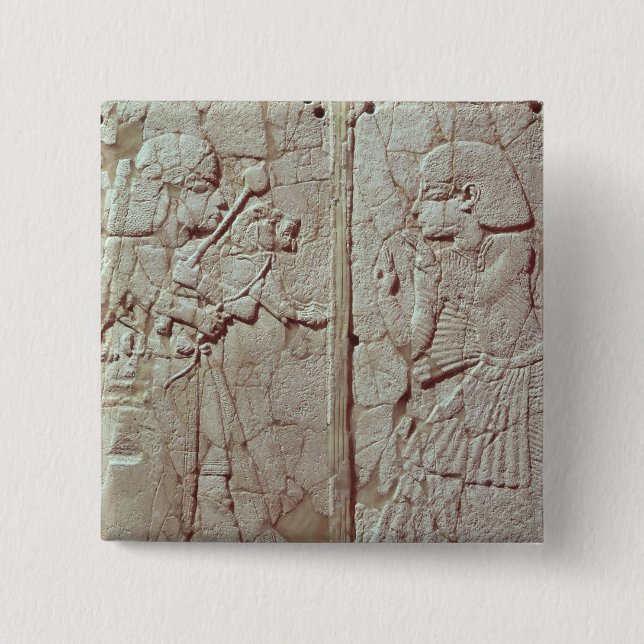 Relief depicting a guard holding 2 inch square button (Front)