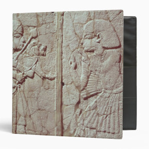 Relief depicting a guard holding binder