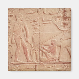 Relief depicting a man milking a cow magnet