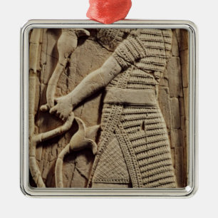 Relief depicting a warrior metal ornament