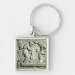 Relief depicting pavers keychain