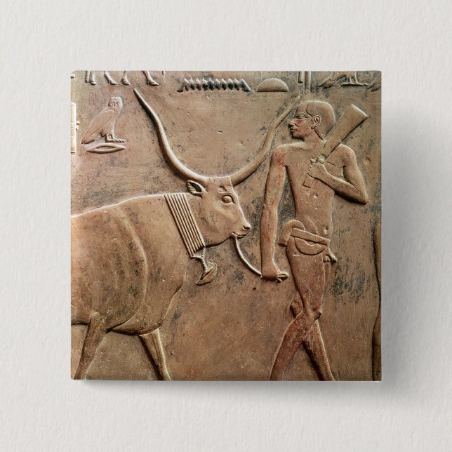 Relief depicting peasant leading cow to 2 inch square button (Front)