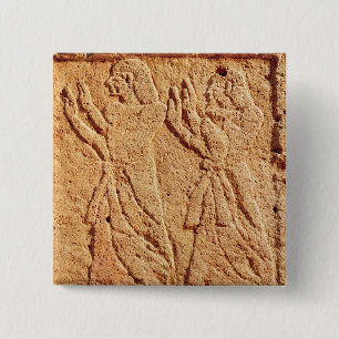 Relief depicting servant paying homage to the 2 inch square button