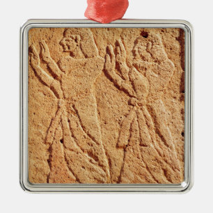 Relief depicting servant paying homage to the metal ornament