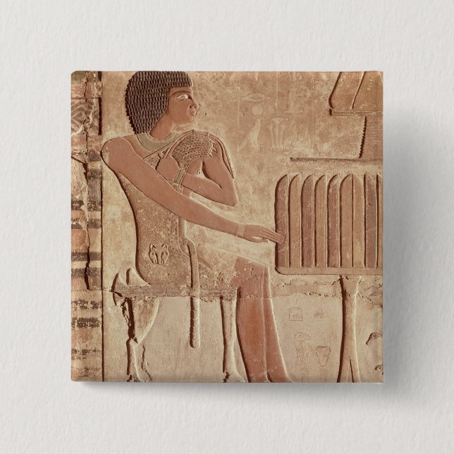 Relief depicting the deceased seated 2 inch square button (Front)