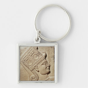 Relief depicting the head of a young prince keychain