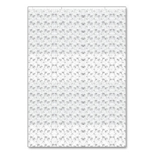 Repeating pattern of small, stylized shapes on a w table number