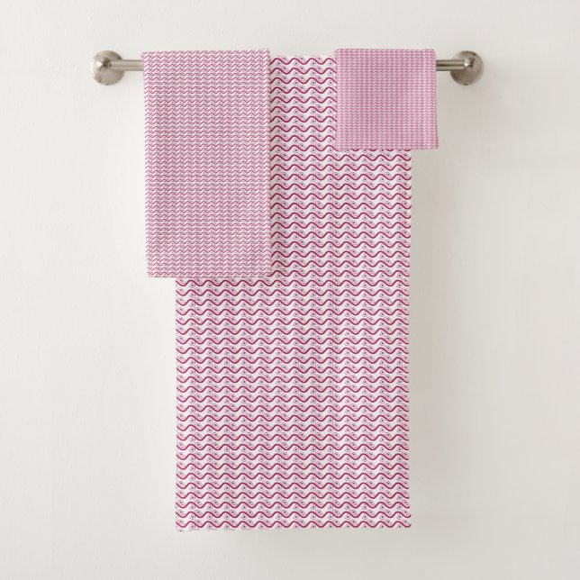 Repeating pattern of small, wavy, reddish-pink lin bath towel set (Insitu)