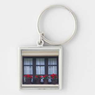 Residential housing with flowers in windows keychain