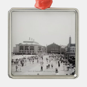 Resort tourists on esplanade metal ornament