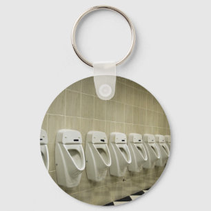 restroom interior with urinal row keychain