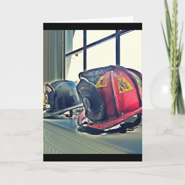 Retired fire helmets line the window sill card (Front)
