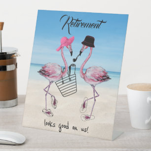 Retirement looks good on us! Flamingo on Beach Pedestal Sign