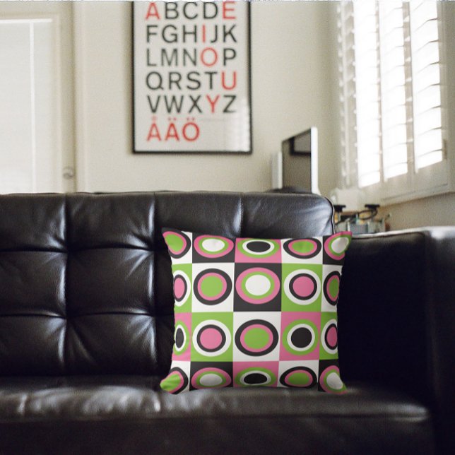 Retro Circles Pattern Pink Green Black White Throw Pillow (A throw pillow with a retro pattern of green, black, pink and white circles)