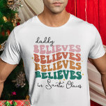 Retro daddy believes Santa Claus Christmas family T-Shirt<br><div class="desc">With its retro font style and vibrant colours,  this Christmas t-shirts bring a jolly vintage vibe to your festivities. The wording reads "Daddy believes in Santa Claus"</div>