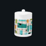 Retro Grid & Starbursts Teapot<br><div class="desc">This Retro Grid and Starbursts Teapot is where vintage style meets modern day. It features a cream coloured background with kitschy, off kilter squares and rectangles in teal, turquoise, This light blue, orange, and avocado green. The whimsical blocks of colour are overlayed are worked into some of the grid intersections....</div>