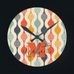 Retro Groovy Pattern Round Clock<br><div class="desc">Your monogram and first name highlight a retro mod circle pattern in a groovy colour palette, this wall clock is fun for you, your kids, and college dorm rooms or give as a gift. (You can remove the monogram and first name, just leave the personalization blank.)</div>